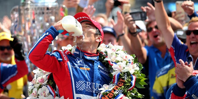 2017 champion Takuma Sato drinking milk.