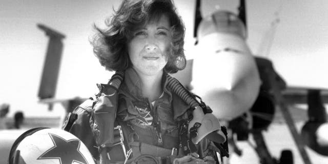 In this image provided by the U.S. Navy, Lt. Tammie Jo Shults, one of the first women to fly Navy tactical aircraft, poses in front of an F/A-18A with Tactical Electronics Warfare Squadron (VAQ) 34 in 1992.