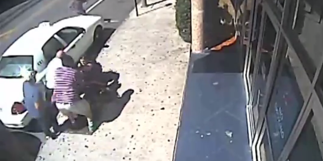 The witnesses raced to help the officers get the suspect under arrest.
