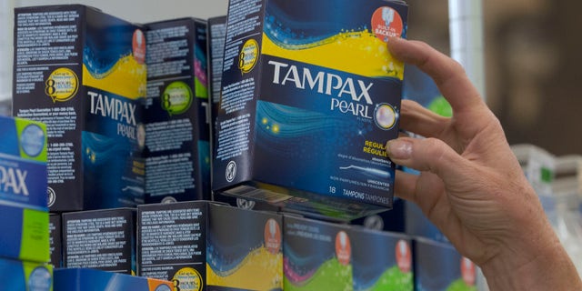 June 22, 2016: Tammy Compton restocks tampons at Compton's Market, in Sacramento, Calif.