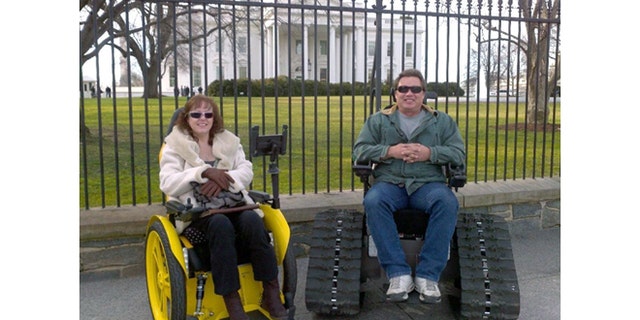 Brad Soden and his wife Liz in front of the White House in a speedster and Tank Chairs which he originally designed to provide more mobility for his wife who was paralyzed in a car accident in 1999.