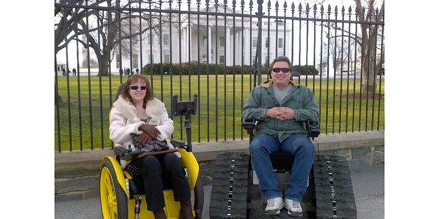 Brad Soden and his wife Liz in front of the White House in a speedster and Tank Chairs which he originally designed to provide more mobility for his wife who was paralyzed in a car accident in 1999.