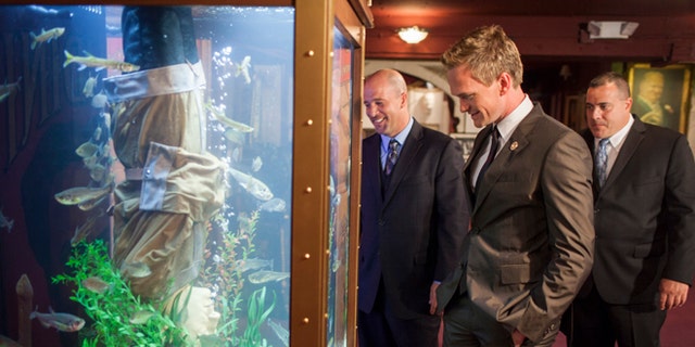 July 20, 2012. Los Angeles, California. Animal Planet's 'Tanked', co-stars, Wayde King and Brett Raymer install a magician themed aquarium at The Magic Castle in Los Angeles. Actor Neil Patrick Harris who is president of The Academy of Magical Arts was present, overseeing the installation. Pictured (L-R) Brett Raymer, Neil Patrick Harris and Wayde King.
Photo © 2012 Discovery Communications