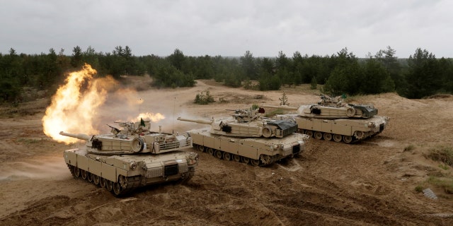 U.S. M1 Abrams tanks fire during the "Saber Strike" NATO military exercise in Adazi, Latvia, June 11, 2016.