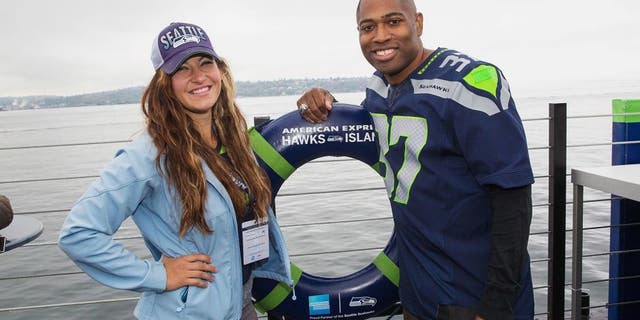 SEATTLE, WA - OCTOBER 18: UFC Mixed Martial Arts Fighter Miesha Tate and Seattle Seahawks Legend Shaun Alexander attend the American Express hosted, never-before-seen pre-game experience for Seattle Seahawks fans and Card Members called American Express Hawks Island on a barge on the Puget Sound. on October 18, 2015 in Seattle, Washington. (Photo by Mat Hayward/Getty Images for American Express)