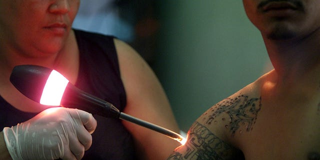 Tattoos mark former gang member  KairosPhotos  Images by Paul Jeffrey