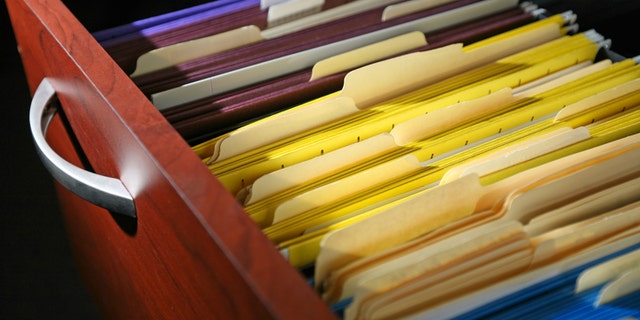 A Picture of a file cabinet draw open