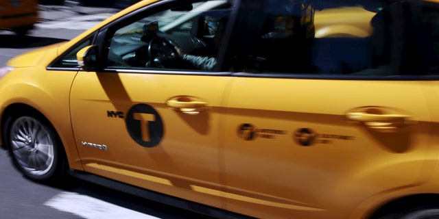 A tech company released a new app Thursday that will do for yellow taxis what Uber does for black cars — connecting riders with drivers and setting a price ahead of time. (REUTERS/Lucas Jackson)