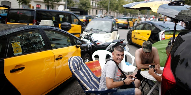 Drivers of Barcelona's signature black and yellow cars have been bringing sections of the city to a standstill last Wednesday.