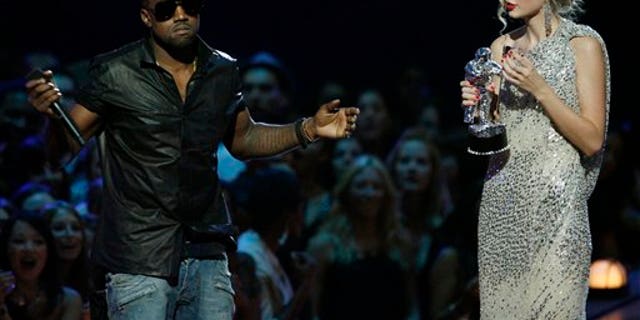 Sept 13, 2009: Singer Kanye West takes the microphone from singer Taylor Swift as she accepts the "Best Female Video" award during the MTV Video Music Awards.