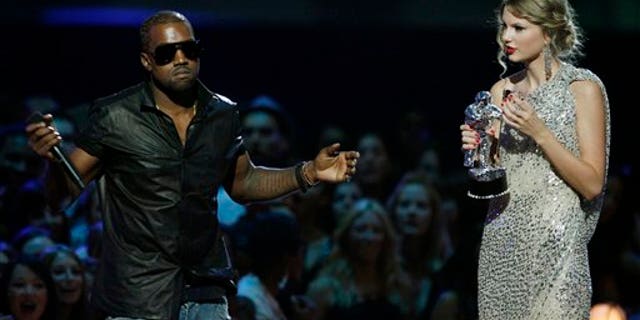 Sept 13, 2009: Singer Kanye West takes the microphone from singer Taylor Swift as she accepts the "Best Female Video" award during the MTV Video Music Awards.
