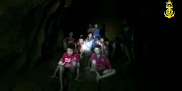 In this grab taken from video provided by Thai Navy SEAL, rescuers get their first view of the boys and their soccer coach.