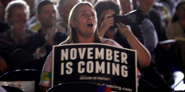 Susan Rocissono, from Mechanicsville, Va., reacts to one of the speakers at the Virginia Tea Party Patriots Convention in Richmond, Va., Friday, Oct. 8, 2010. (AP Photo/Richmond Times-Dispatch, Bob Brown)