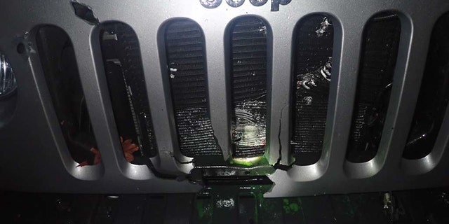 A science teacher's home was raided in connection with a homemade pipe bomb that exploded under a principal's vehicle.