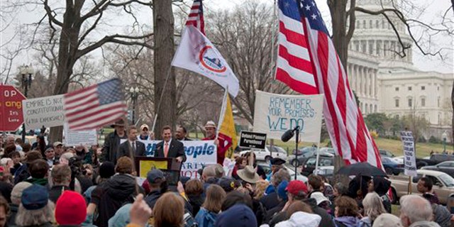 Sen. Jim DeMint, at podium, addresses a Tea Party rally March 31 on Capitol Hill.