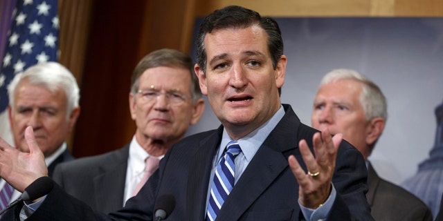 Sen. Ted Cruz, R-Texas, criticizes President Barack Obama, saying he has not taking a stand on the immigration crisis on the U.S.-Mexico border and is putting off executive action until after the politically-charged midterm election in November, Tuesday, Sept. 9, 2014, during a news conference on Capitol Hill in Washington. From left are, Rep. John Carter, R-Texas, Rep. Lamar S. Smith, R-Texas, Cruz, and Rep. Mo Brooks, R-Ala. Cruz said that the reason unaccompanied minors flooded the Southwest border during the summer is that they believe they will get amnesty and be allowed to stay in the United States. (AP Photo/J. Scott Applewhite)