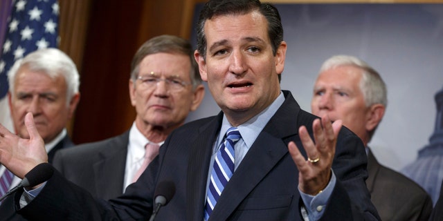 Sen. Ted Cruz, R-Texas, criticizes President Barack Obama, saying he has not taking a stand on the immigration crisis on the U.S.-Mexico border and is putting off executive action until after the politically-charged midterm election in November, Tuesday, Sept. 9, 2014, during a news conference on Capitol Hill in Washington. From left are, Rep. John Carter, R-Texas, Rep. Lamar S. Smith, R-Texas, Cruz, and Rep. Mo Brooks, R-Ala. Cruz said that the reason unaccompanied minors flooded the Southwest border during the summer is that they believe they will get amnesty and be allowed to stay in the United States. (AP Photo/J. Scott Applewhite)