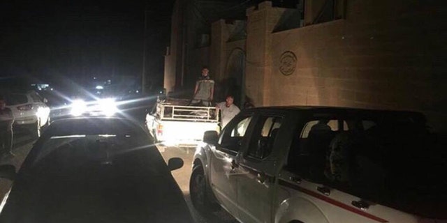 Villagers rushed to leave Teleskof on Tuesday evening after an Iraqi emissary told them to evacuate before sunrise in anticipation of further gunfire.