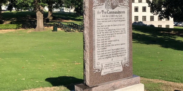 A 6-foot-tall privately funded Ten Commandments monument is seen on the Arkansas Capitol grounds in Little Rock on Tuesday, June 27, 2017, after it was installed by workers two years after lawmakers approved a measure allowing the statue on state property. (AP Photo/Andrew DeMillo)
