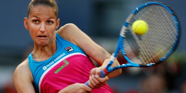 Karolina Pliskova from Czech Republic returns a ball from Czech Republic's Petra Kvitova during a Madrid Open tennis tournament semifinal match in Madrid, Spain