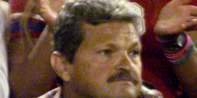 Nick Philippoussis, father of Australian tennis star Mark Philippoussis, watches his son play during the Australian Open in Melbourne, in an undated photo.