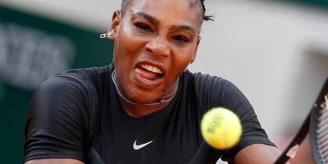 Serena Williams of the U.S. returns a shot against Germany's Julia Georges during their third round match of the French Open tennis tournament at the Roland Garros stadium in Paris.