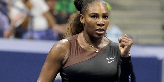 Serena Williams reacts after a point against Magda Linette, of Poland, during the first round of the U.S. Open tennis tournament