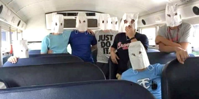 Tennis players from Teflair County High School in McRae, GA posed with white bags that look like KKK hoods after losing to a team with black members.