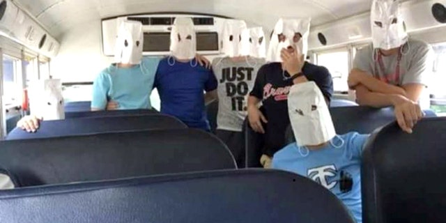Tennis players from Teflair County High School in McRae, GA posed with white bags that look like KKK hoods after losing to a team with black members.