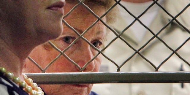 Aug. 24, 2012: Lois Goodman with her attorney, Allison Triessl, left, as her arraignment on murder charges is postponed, in Los Angeles. The tennis referee accused of beating her 80-year-old husband to death has had two knee replacements and a shoulder replacement and couldn't have carried out the killing, her lawyer wrote in a court filing. (AP)