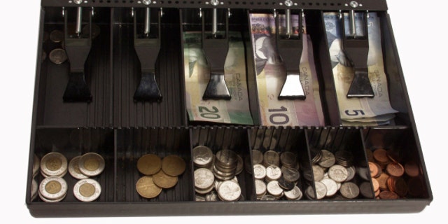 store's cash register in canadian funds