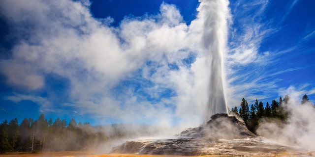 Castle Geyser erupting at Yellowstone National Park. Nearly 5 million people visited Yellowstone in 2021.