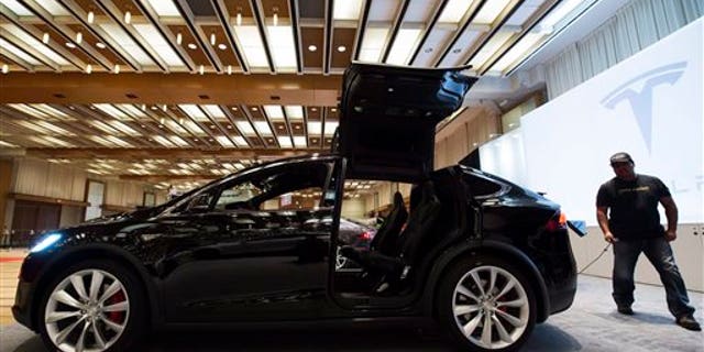The Tesla Model X is shown at the 2016 Canadian International Autoshow in Toronto on Feb. 11, 2016. (Nathan Denette/The Canadian Press via AP)
