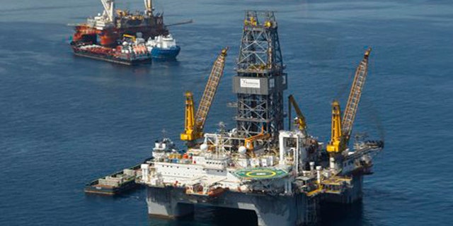 Aug. 3, 2010: Development Driller III, which is drilling the primary relief well, and the Helix Q4000, background left, the vessel being used to perform the static kill operation, at the site of the Deepwater Horizon Oil Spill in Gulf of Mexico, off the coast of Louisiana.