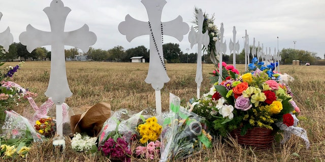 Crosses mark the number of victims in the shooting at a church in Sutherland Springs, Texas.
