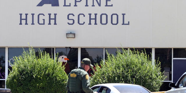 Sept. 8, 2016: A United States Border Patrol officer patrols the perimeter at Alpine High School after a shooting in Alpine, Texas.