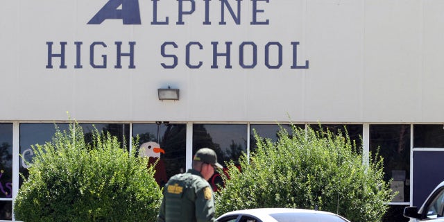 Sept. 8, 2016: A United States Border Patrol officer patrols the perimeter at Alpine High School after a shooting in Alpine, Texas.