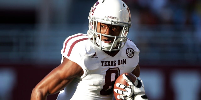 Nov. 10, 2012: In this file photo, Texas A&M wide receiver Thomas Johnson (8) carries for extra yardage after a reception during an NCAA college football game in Tuscaloosa, Ala.