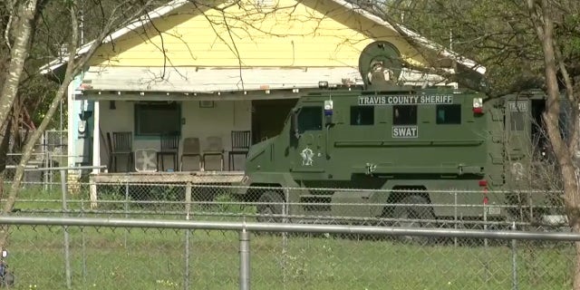 Authorities investigate the home of the suspected Austin serial bomber in Pflugerville, Texas.