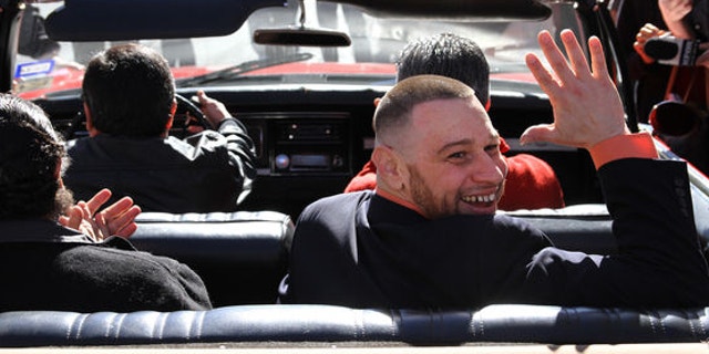 Daniel Villegas waves as he leaves county jail in El Paso, Texas. Villegas, convicted in 1995 for the murder of two teens, was released on bond after a court of appeals ruled his defense was inefficient during the 1995 trial.