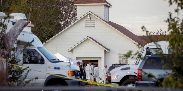 Investigators work at the scene of a deadly shooting at the First Baptist Church in Sutherland Springs.