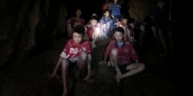 This Monday, July 2, 2018, file photo released by Tham Luang Rescue Operation Center, shows the boys and their soccer coach as they were found in a partially flooded cave, in Mae Sai, Chiang Rai, Thailand.
