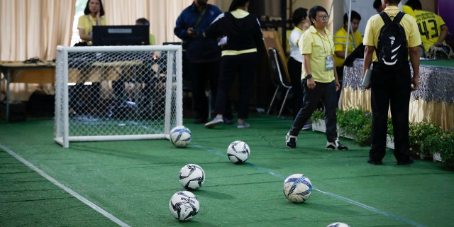 A mini soccer field being set up before a press conference on the 12 boys and coach released from the hospital in Chiang Rai province, northern Thailand, Wednesday, July 18, 2018