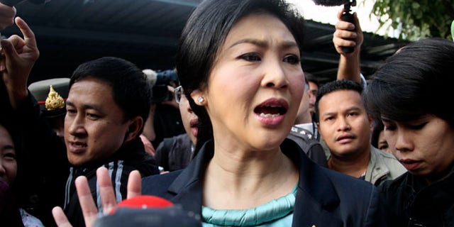 Feb. 2, 2014: Thai Prime Minister Yingluck Shinawatra leaves a polling station after casting her ballot for the general election in Bangkok, Thailand.