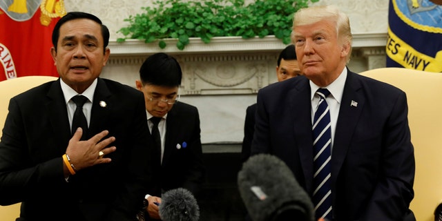U.S. President Donald Trump meets with Thai Prime Minister Prayut Chan-o-Cha in the Oval Office of the White House in Washington, U.S., October 2, 2017. REUTERS/Kevin Lamarque - RC1E138B1B30