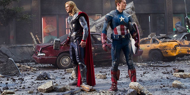 Two Avengers survey a partially destroyed New York, the work of a self-powered energy vortex thingy.
