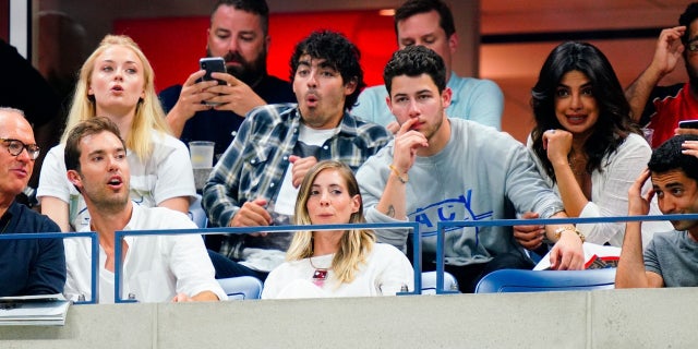 Sophie Turner, Joe Jonas, Nick Jonas and Priyanka Chopra sit together and watch the U.S. Open on Tuesday, September 4, 2018.