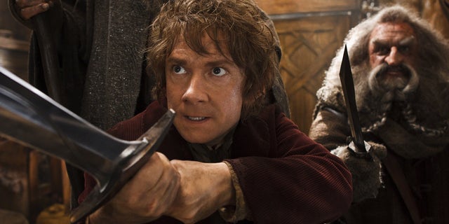 Martin Freeman, left, and John Callen in a scene from "The Hobbit: The Desolation of Smaug."