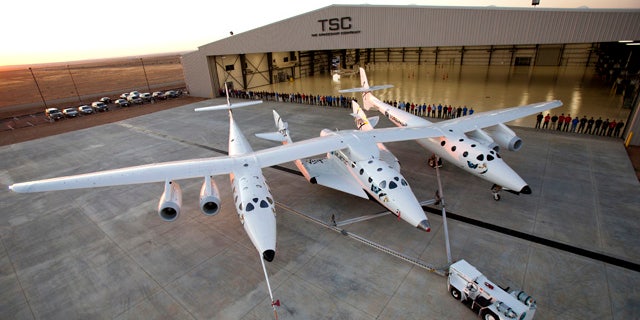 Sept. 19, 2011: More than 80 employees of The SpaceShip Company gather for a group photo at their new hangar facility, FAITH (final assembly integration test hangar), at the Mojave Air and Space Port in Mojave, CA.