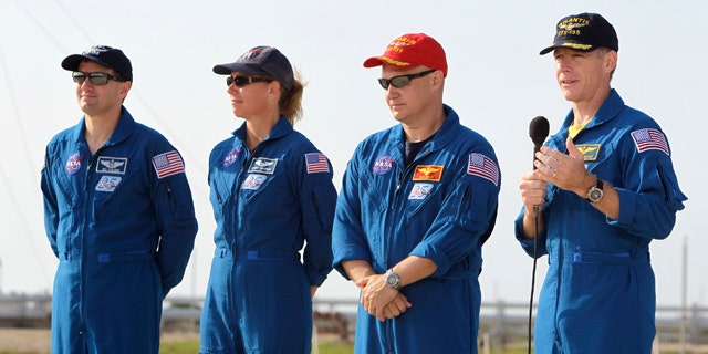 The crew of space shuttle Atlantis, from left, mission specialist Rex Walhiem, mission specialist Sandy Magnus, pilot Doug Hurley and commander Chris Ferguson attend a news conference at Pad 39A during the Terminal Countdown Demonstration Test at the Kennedy Space Center in Cape Canaveral, Fla., Wednesday, June 22, 2011.